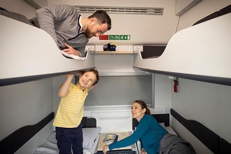 Family in a couchette comfort compartment
