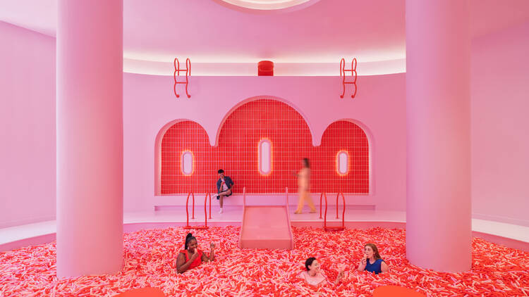 People hanging out inside the Museum of Ice Cream Chicago's sprinkle pool