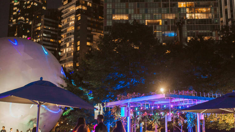 The NGV Garden lit up with bright colours. 