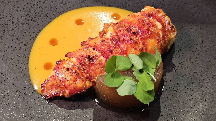 Butter aged lobster tail grilled on lava stone 
