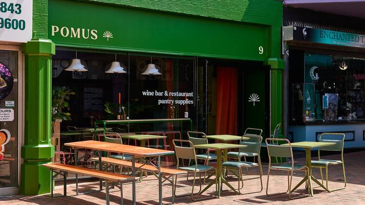 Have a glass of orange at wine bar Pomus