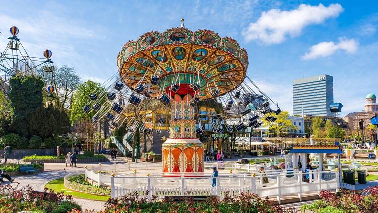 COPENHAGEN, DENMARK - APRIL 15 2024: Tivoli Gardens in Copenhagen is the world's second-oldest, 19th-century amusement park with antique roller coaster and live entertainment program.