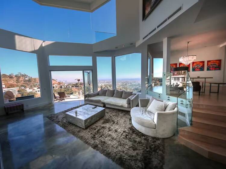 large living room with windows revealing views of hollywood