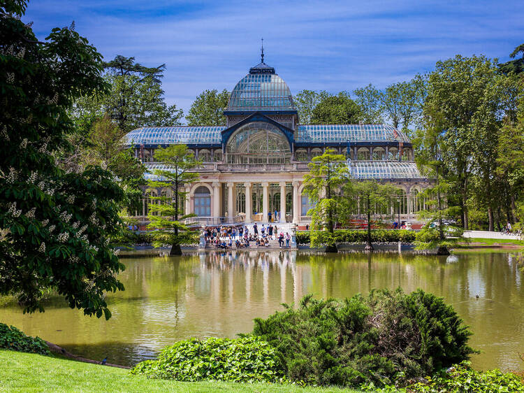 View of the beautiful Palacio de Cristal a conservatory located in El Retiro Park built in 1887 in Madrid