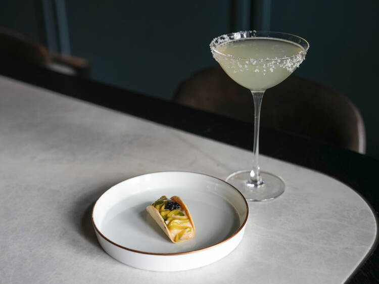 Cocktail and a snack at The Douglas Club.