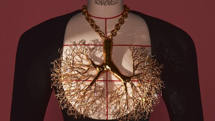 Gilded brass necklace adorned with rhinestones in the shape of lungs