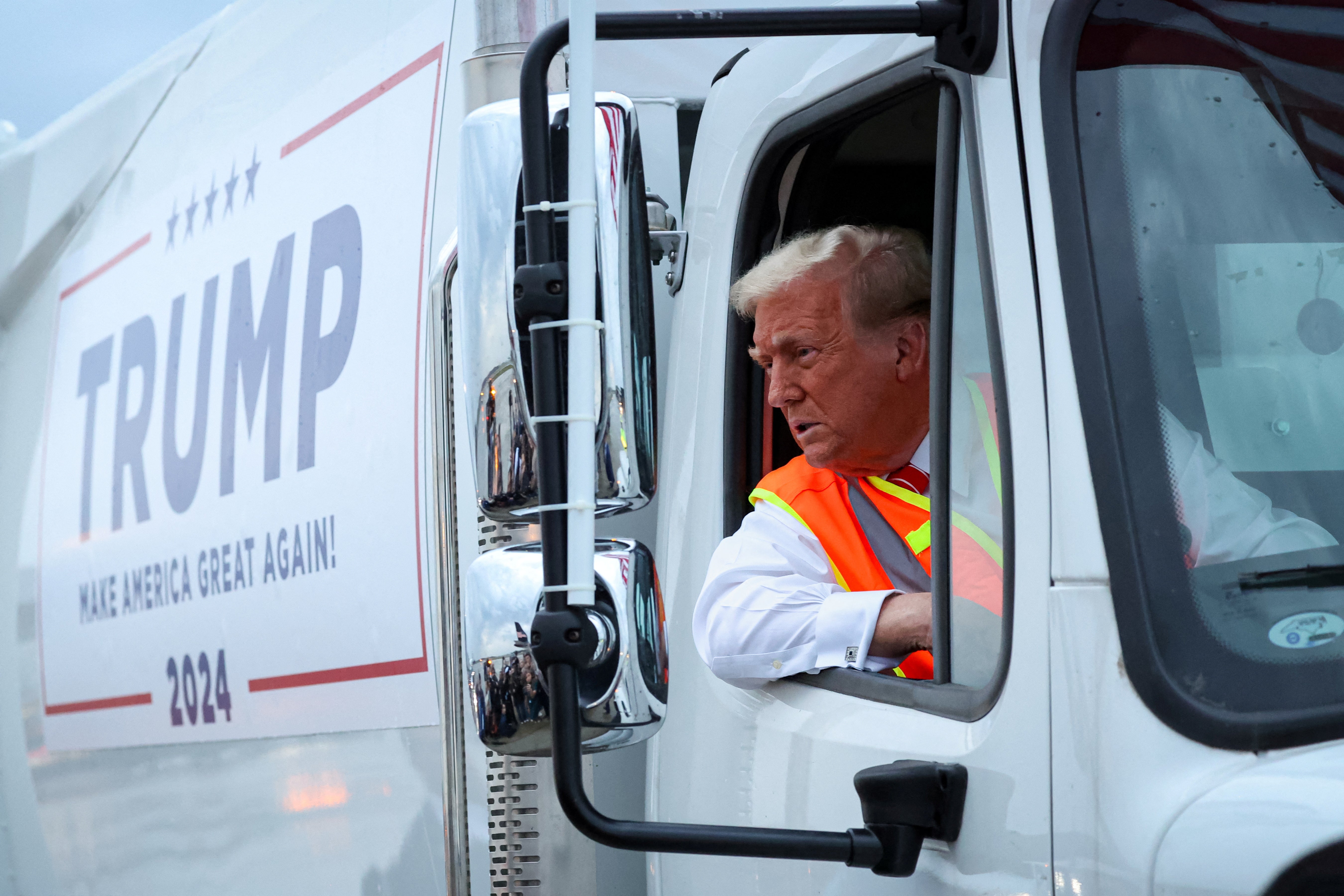 Donald Trump behind the wheel of a garbage truck as part of a campaign stunt during last year’s election