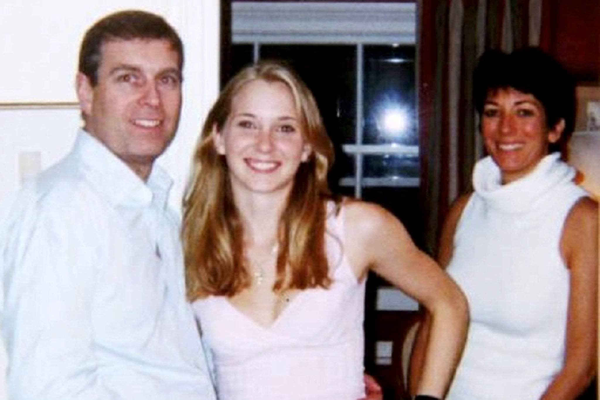 The photo of a young Giuffre (then Virginia Roberts) with Maxwell and Prince Andrew, both of whom have claimed the image is fake