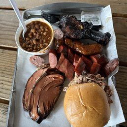 Photo of Burn Co Barbeque - Sampler of pulled pork, baloney, Baked Beans, chicken drumstick, and three sausages!