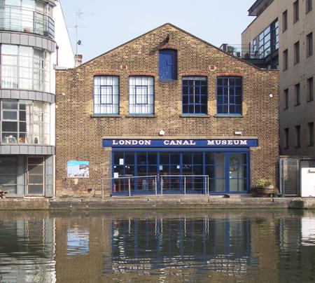 Building rear elevation pitched roof and water in the foreground